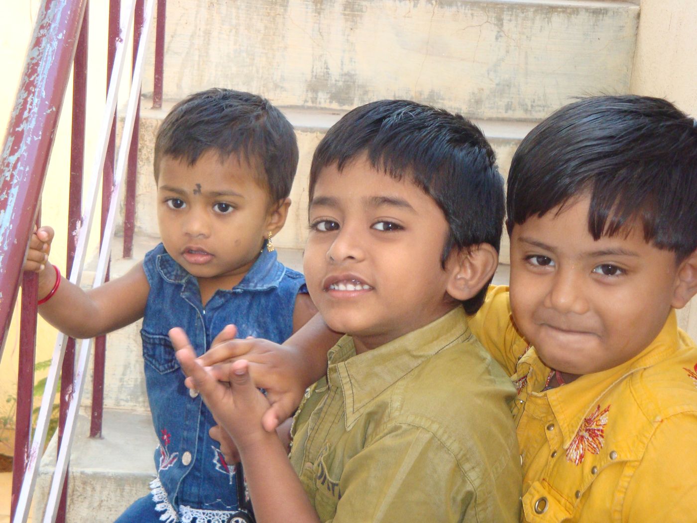 Three children on a staircase