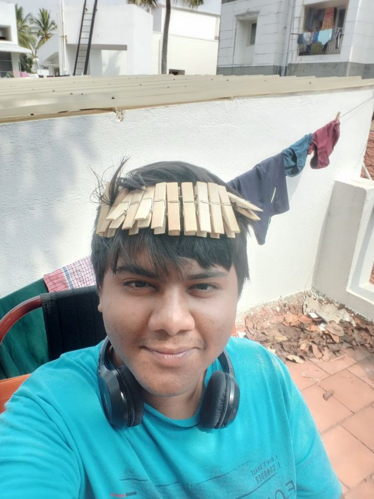 Selfie on a terrace with clothes pegs on my head