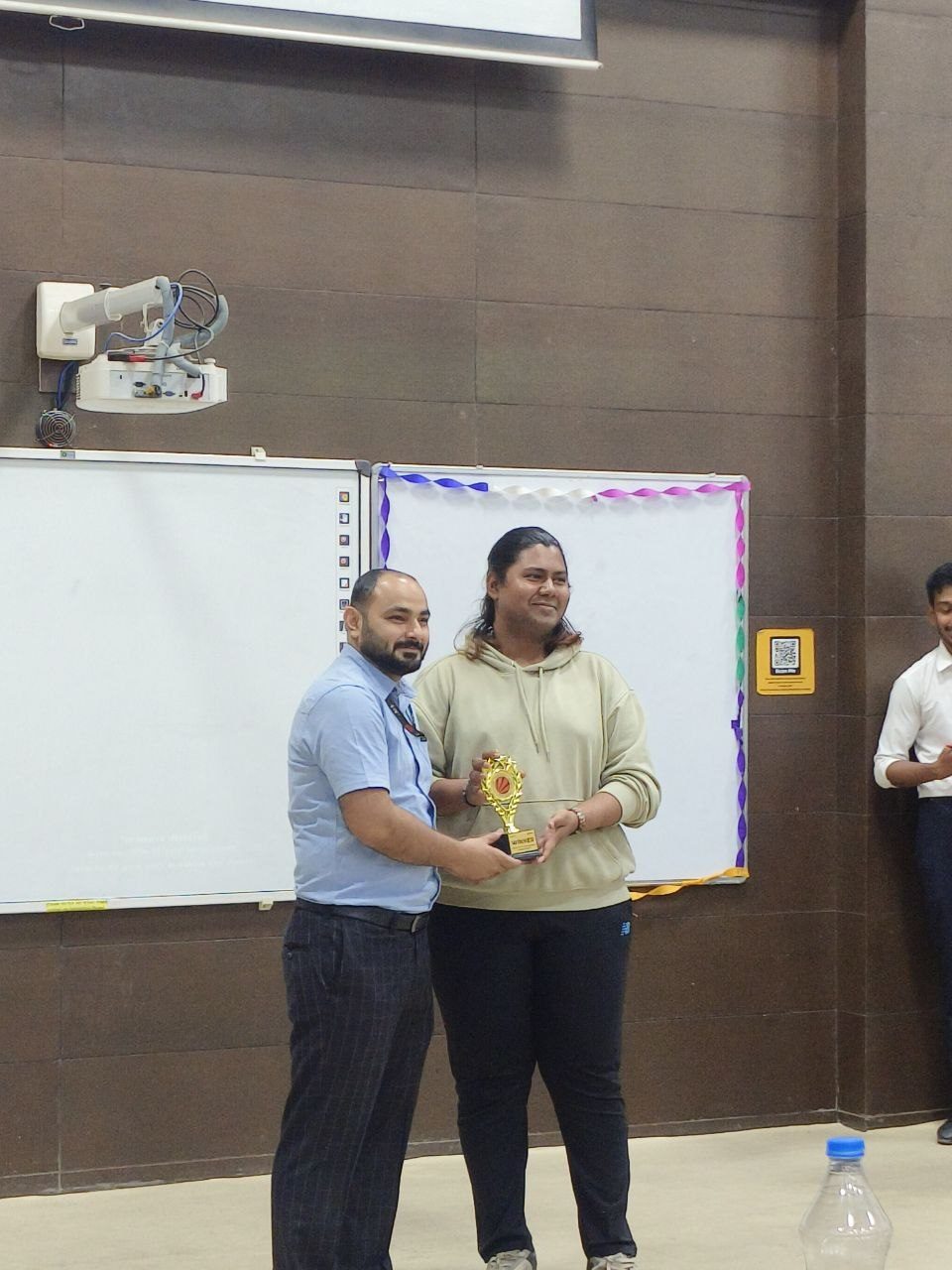 Receiving a trophy in a classroom
